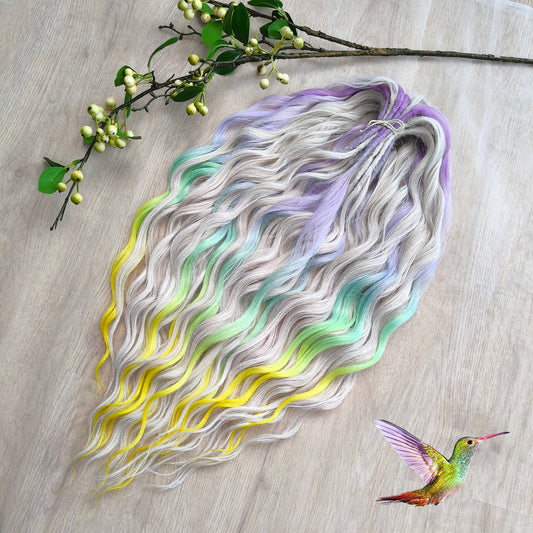 The mix of Platinum Blonde and Multicolored ombre from purple/lavender to light green and yellow soft, lightweight, and reusable synthetic brushable double ended wavy dreadlocks (regular dreaded or push-up): 2/3 parts of blonde + 1/3 part of rainbow