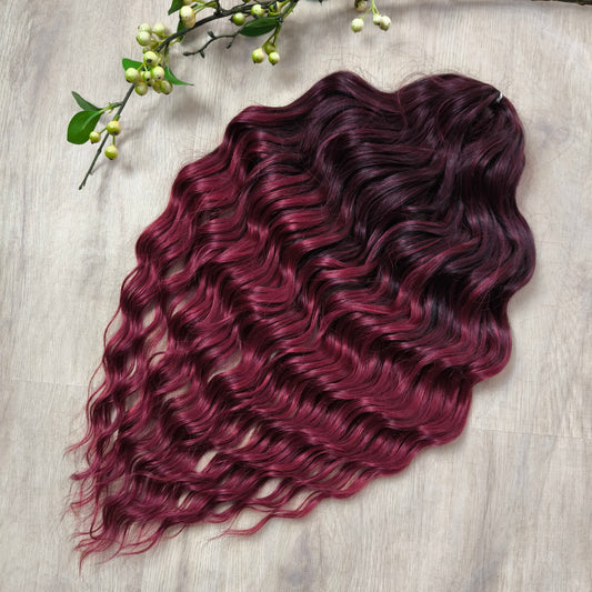 Maroon soft, lightweight, and reusable synthetic brushable double ended wavy dreadlocks.