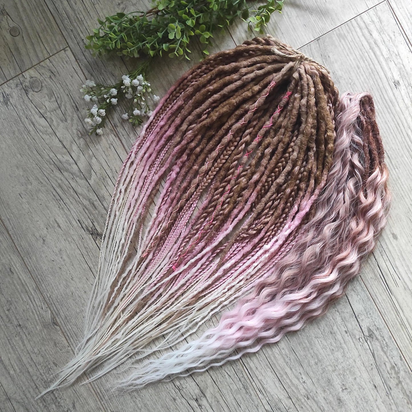 IceCream – double ended synthetic crochet dreadlocks and braids.
At the roots, the color starts with warm caramel and nude blonde tones, gradually transitioning towards the ends into delicate pastel pink and platinum blonde. The gradient is smooth and airy, with a light pastel feel and no harsh contrasts.

A soft, creamy blend inspired by strawberry and vanilla ice cream in a waffle cone.