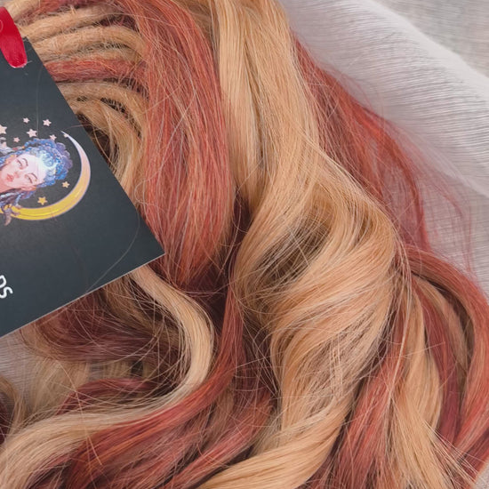 Copper Honey - 60 DE soft, lightweight, and reusable synthetic standard dreaded brushable curls Manasi. Peach blonde base mixed with copper red.