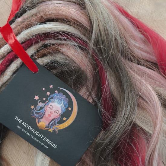 Soft, lightweight, and reusable synthetic brushable double ended wavy dreadlocks (regular dreaded or push-up). Mix of a few colors: platinum and ombre wheat blondes, various pink, and burgundy.