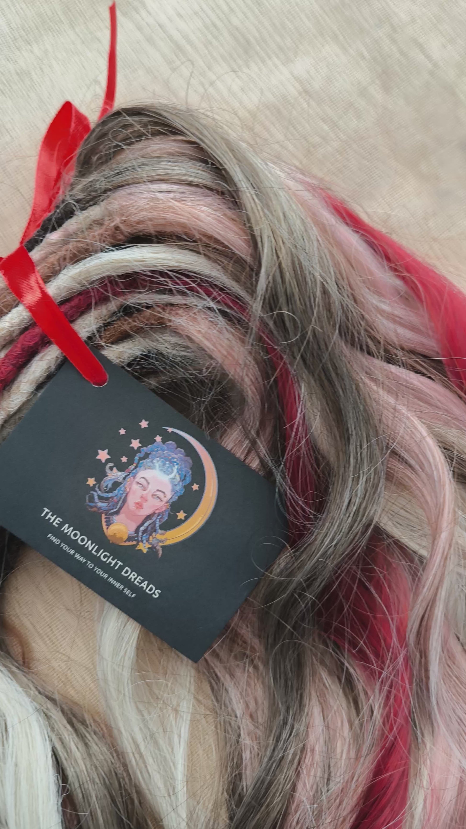 Soft, lightweight, and reusable synthetic brushable double ended wavy dreadlocks (regular dreaded or push-up). Mix of a few colors: platinum and ombre wheat blondes, various pink, and burgundy.