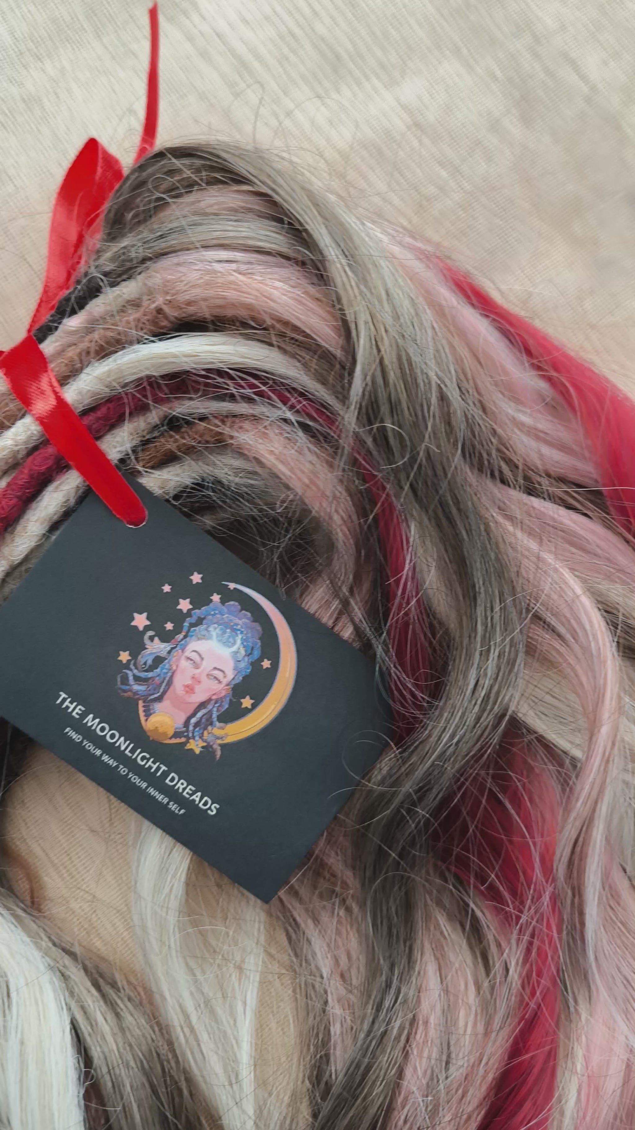 Soft, lightweight, and reusable synthetic brushable double ended wavy dreadlocks (regular dreaded or push-up). Mix of a few colors: platinum and ombre wheat blondes, various pink, and burgundy.