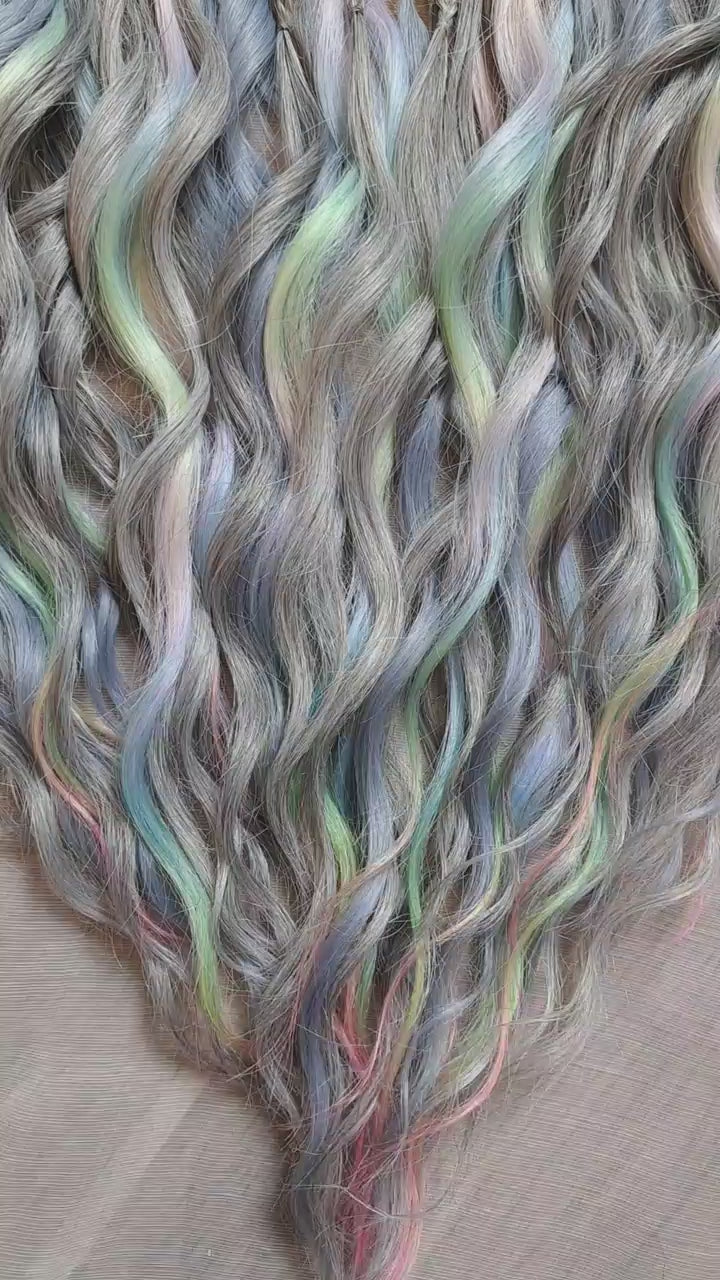 Moon Pearl - soft, lightweight, and reusable synthetic brushable double ended wavy dreadlocks (regular dreaded, braided middle, or push-up).

A blend of pearl grey, icy blue, soft mint, lavender, and blush pink - subtle, airy, and full of depth. The pastel shades appear gently throughout the set, creating a shimmering effect without overpowering the base color.
