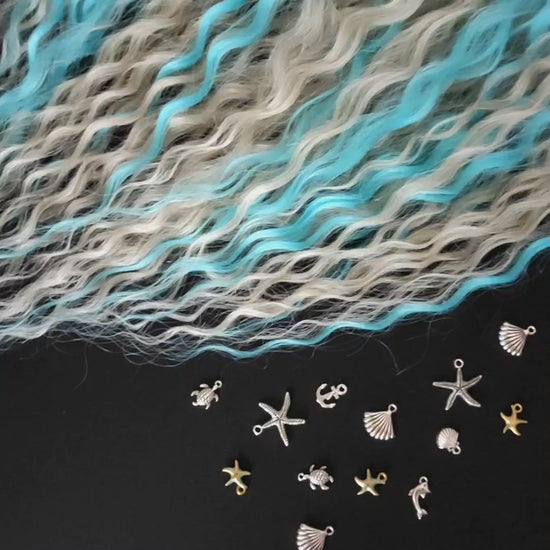 This is a soft, lightweight, and reusable synthetic set of double-ended regular curls (NOT BRUSHABLE) in a mix of platinum blonde and blue.