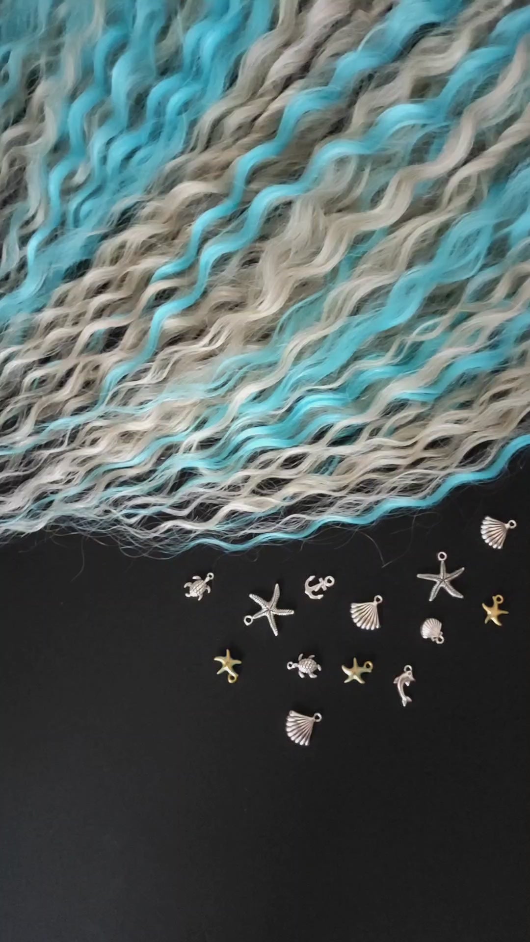 This is a soft, lightweight, and reusable synthetic set of double-ended regular curls (NOT BRUSHABLE) in a mix of platinum blonde and blue.
