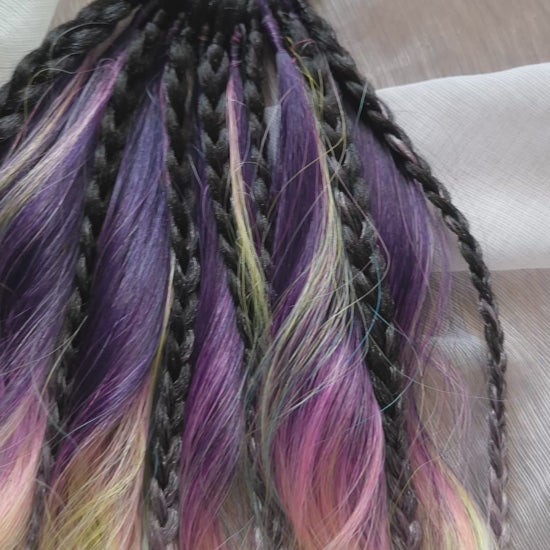 Gradient from deep purple to yellow, pink, and blue braids and curls on an elastic band — a simple way to transform a ponytail without installing a set. Easy to put on and remove whenever you like. A great option if you can’t install dreads or braids. Also, a perfect gift for kids