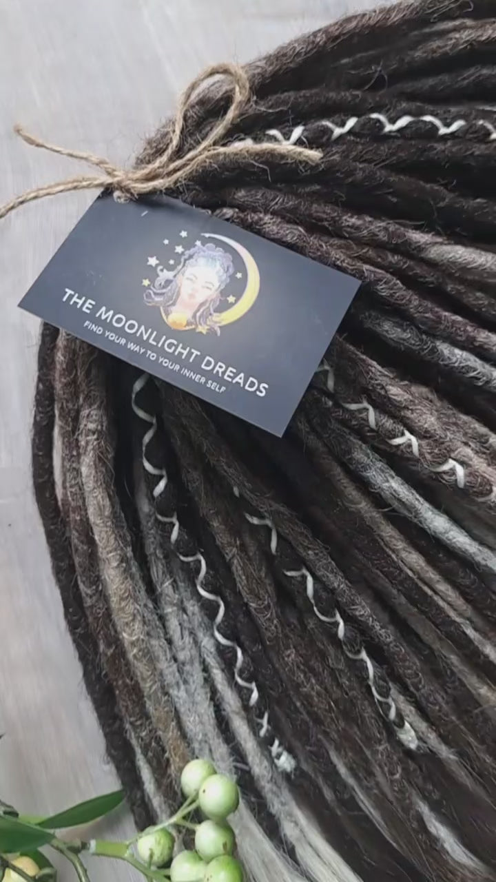 Soft, lightweight,  reusable synthetic double ended crochet dreadlocks, with curly brushable ends (colors based on the colors from the Smoky Mix set):

- chocolate brown;
- ombre from medium to light brown;
- ashy wheat blonde with dark roots;
- light blonde with dark roots.

