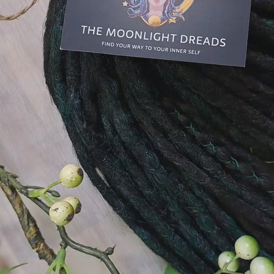 Deep forest dreads - Black and ombre emerald synthetic set of 50 double ended crochet dreadlocks.

Length: ±18-20 inches (45-50 cm)
Thickness of dreads and braids: ±0.8-1 cm
Weight with decoration: ±315 gr (11 oz)