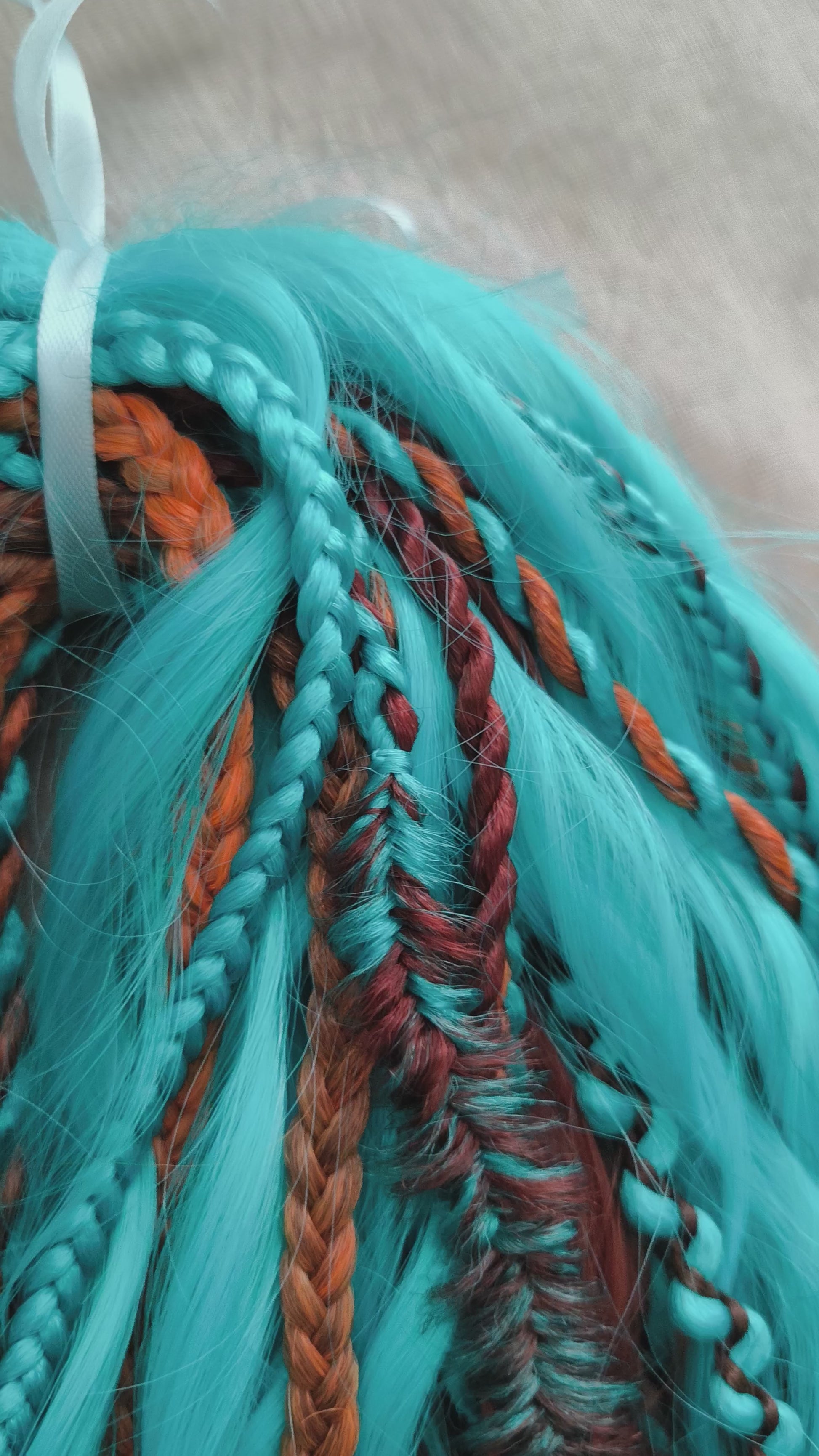 Ginger Sky: soft, lightweight, and reusable double ended various DE synthetic braids and regular dreaded brushable curls. A mix of turquoise green, red, copper, and orange colors.

The length is 22-24 inches (55-60 cm)
Dreaded part of curls: 4-5 inches
Thickness of braids ±0.8 cm
