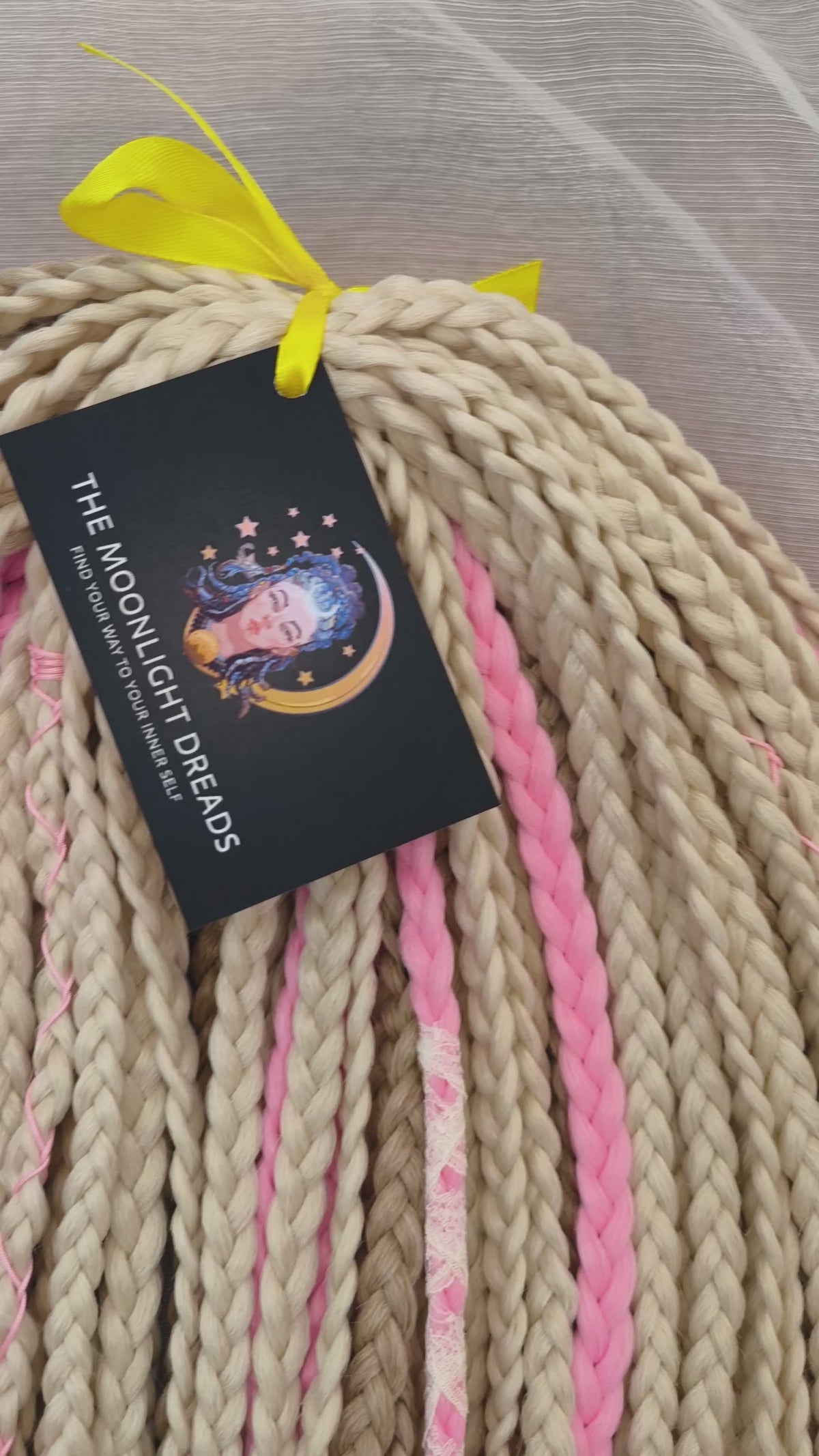 Vanilla Rose - a soft, lightweight, and reusable set of DE synthetic braids in creamy vanilla blonde, beige, and soft pink shades