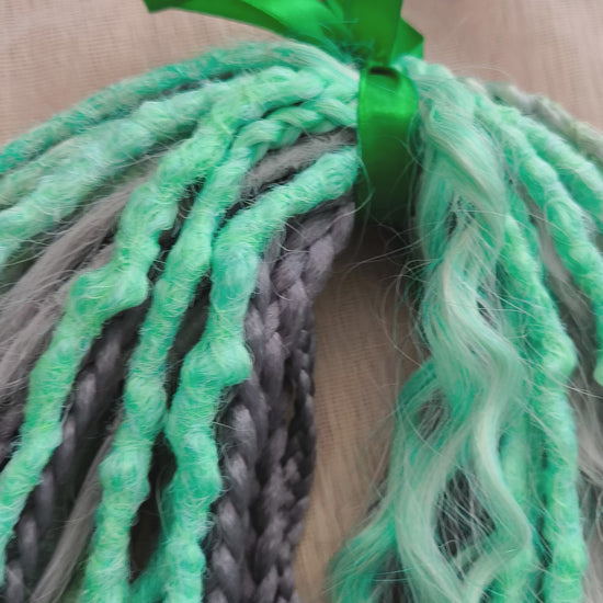 Mix of silver grey and mint green synthetic partial set of 34 double ended dreads, braids, dreaded curls.