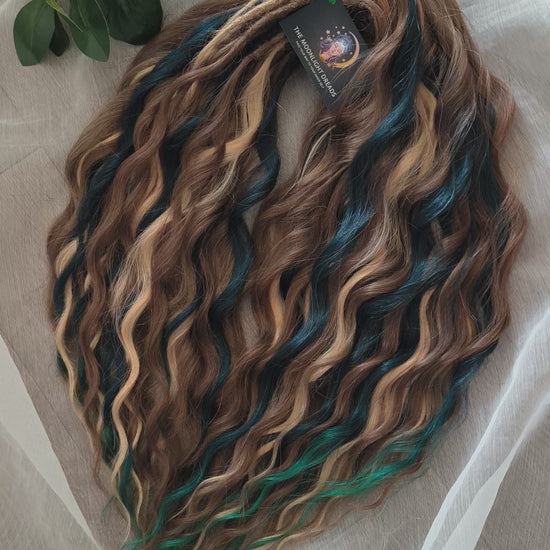 Sylvan - 50 double ended ready-to-ship warm brown, golden blonde, midnight teal synthetic brushable wavy dreadlocks. Soft, lightweight, and reusable, woodland-inspired blend with a touch of dark, mysterious magic.