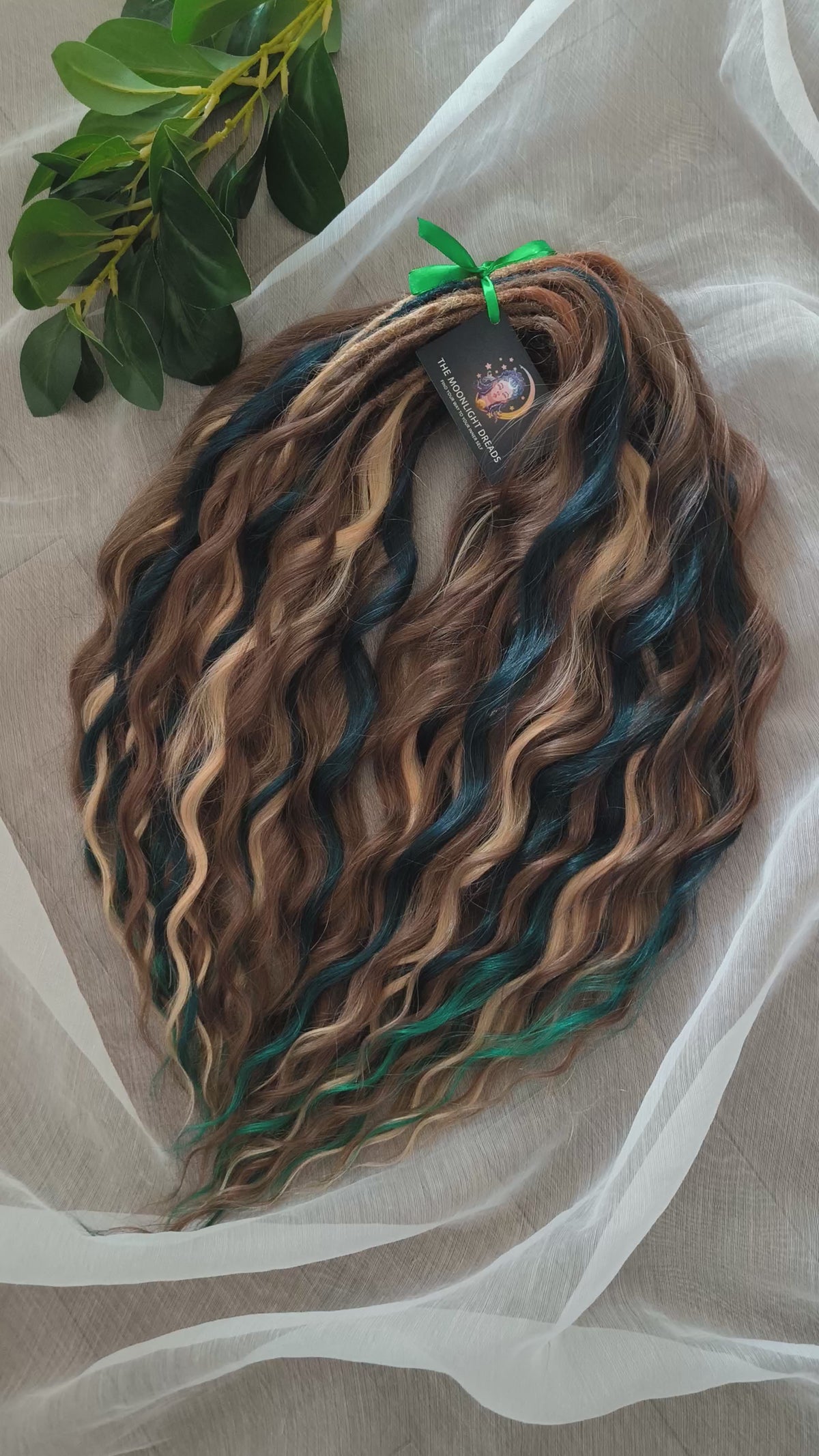 Sylvan - 50 double ended ready-to-ship warm brown, golden blonde, midnight teal synthetic brushable wavy dreadlocks. Soft, lightweight, and reusable, woodland-inspired blend with a touch of dark, mysterious magic.