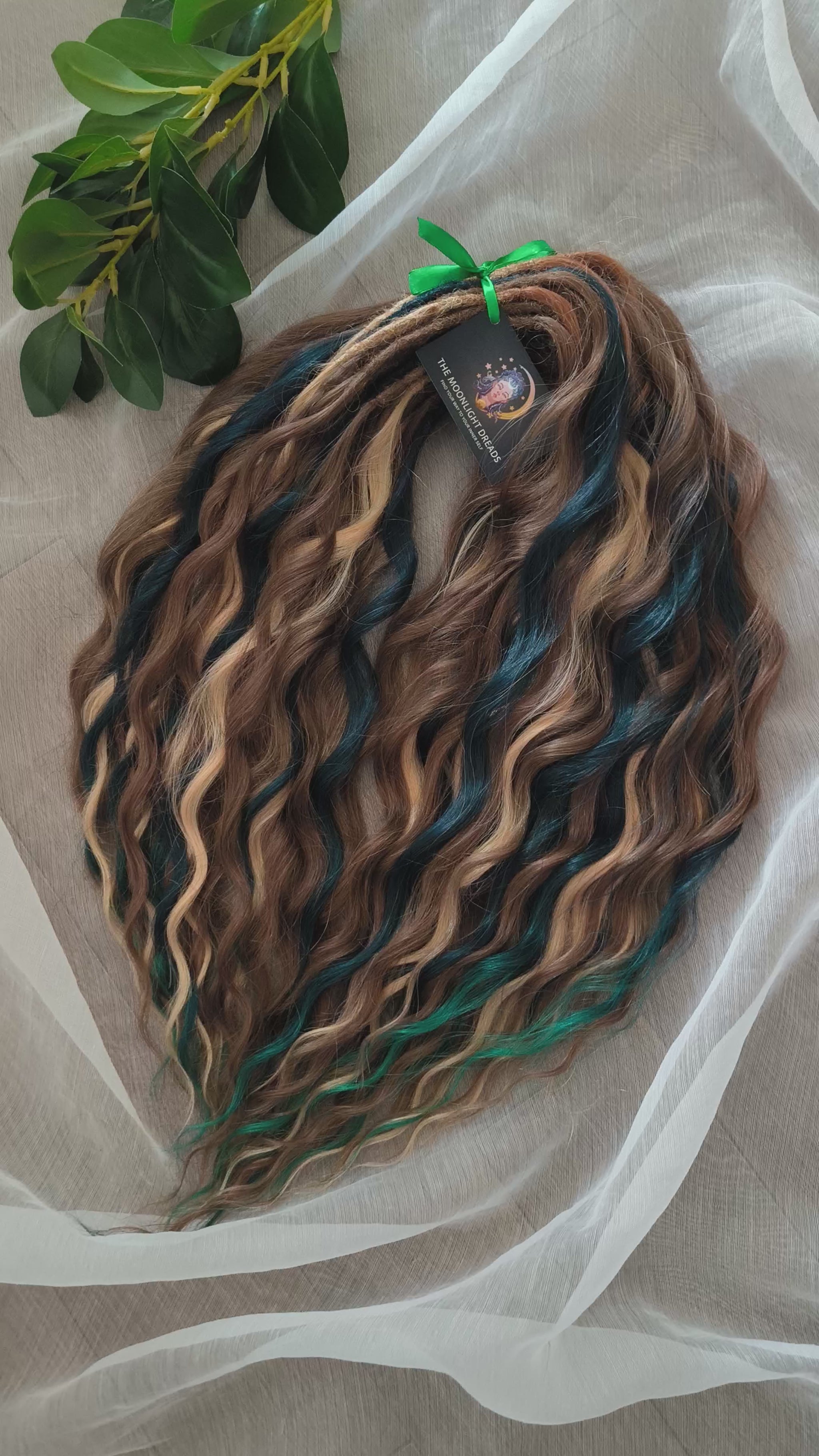 Sylvan - 50 double ended ready-to-ship warm brown, golden blonde, midnight teal synthetic brushable wavy dreadlocks. Soft, lightweight, and reusable, woodland-inspired blend with a touch of dark, mysterious magic.