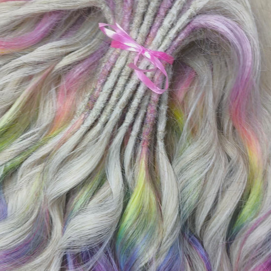 The mix of Platinum blonde and Rainbow/glitch/prism effect (2/3 parts of blonde + 1/3 part of rainbow) soft, lightweight, and reusable synthetic brushable double ended wavy dreadlocks (regular dreaded or push-up).