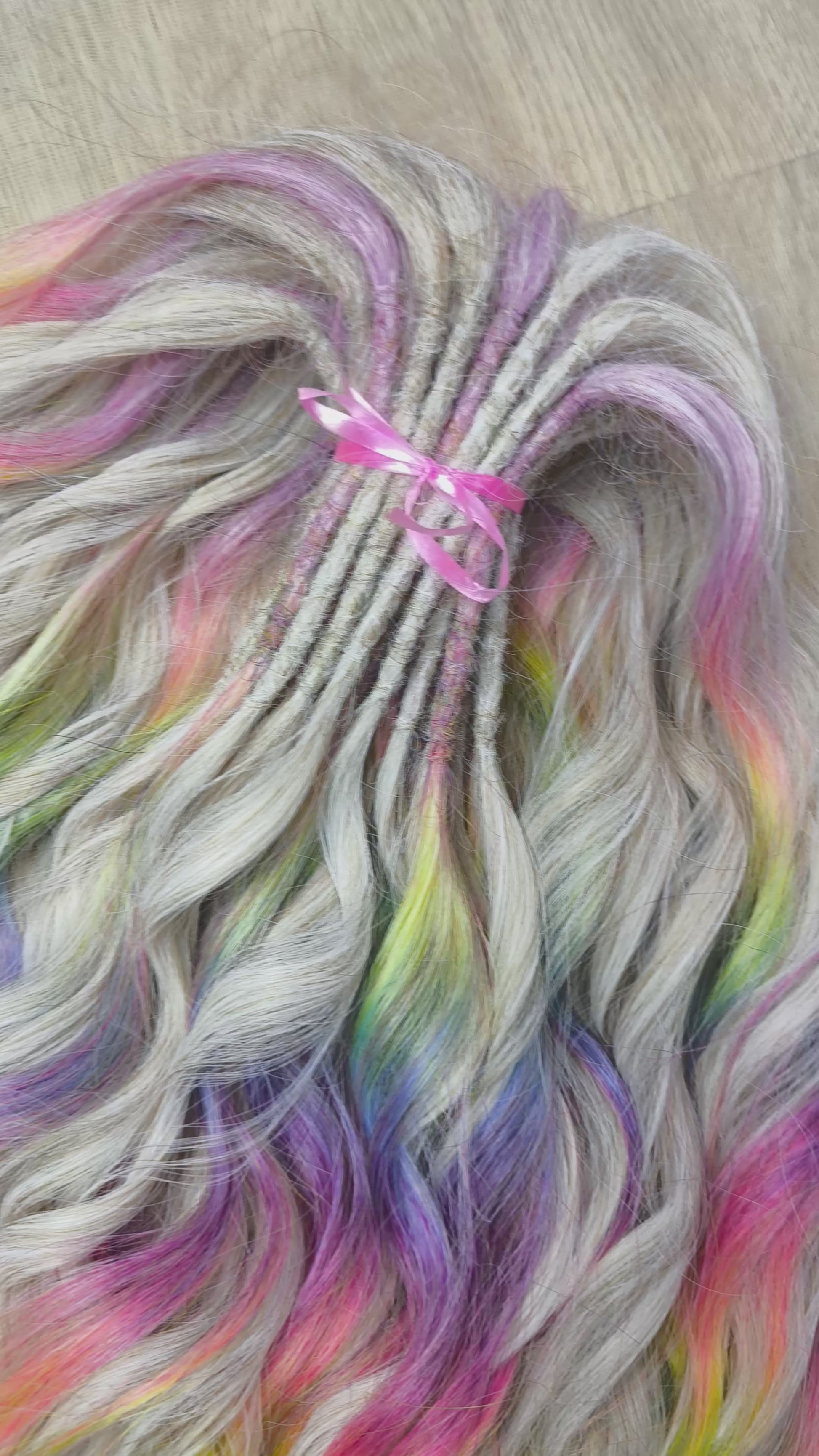 The mix of Platinum blonde and Rainbow/glitch/prism effect (2/3 parts of blonde + 1/3 part of rainbow) soft, lightweight, and reusable synthetic brushable double ended wavy dreadlocks (regular dreaded or push-up).