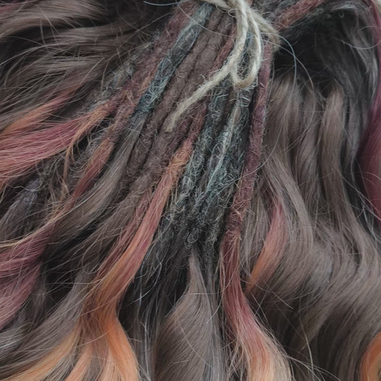 This moody, elegant set of soft, lightweight, and reusable synthetic brushable double-ended wavy dreadlocks features 2 shades of brown as the main color, enriched with calico strands. 