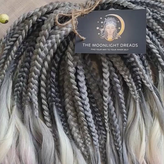 Rainbow Ash - smoky silver, graphite, and rainbow/prism with icy blonde highlights. Soft, lightweight, and reusable synthetic brushable double ended wavy dreadlocks (regular dreaded, braided middle, or push-up).