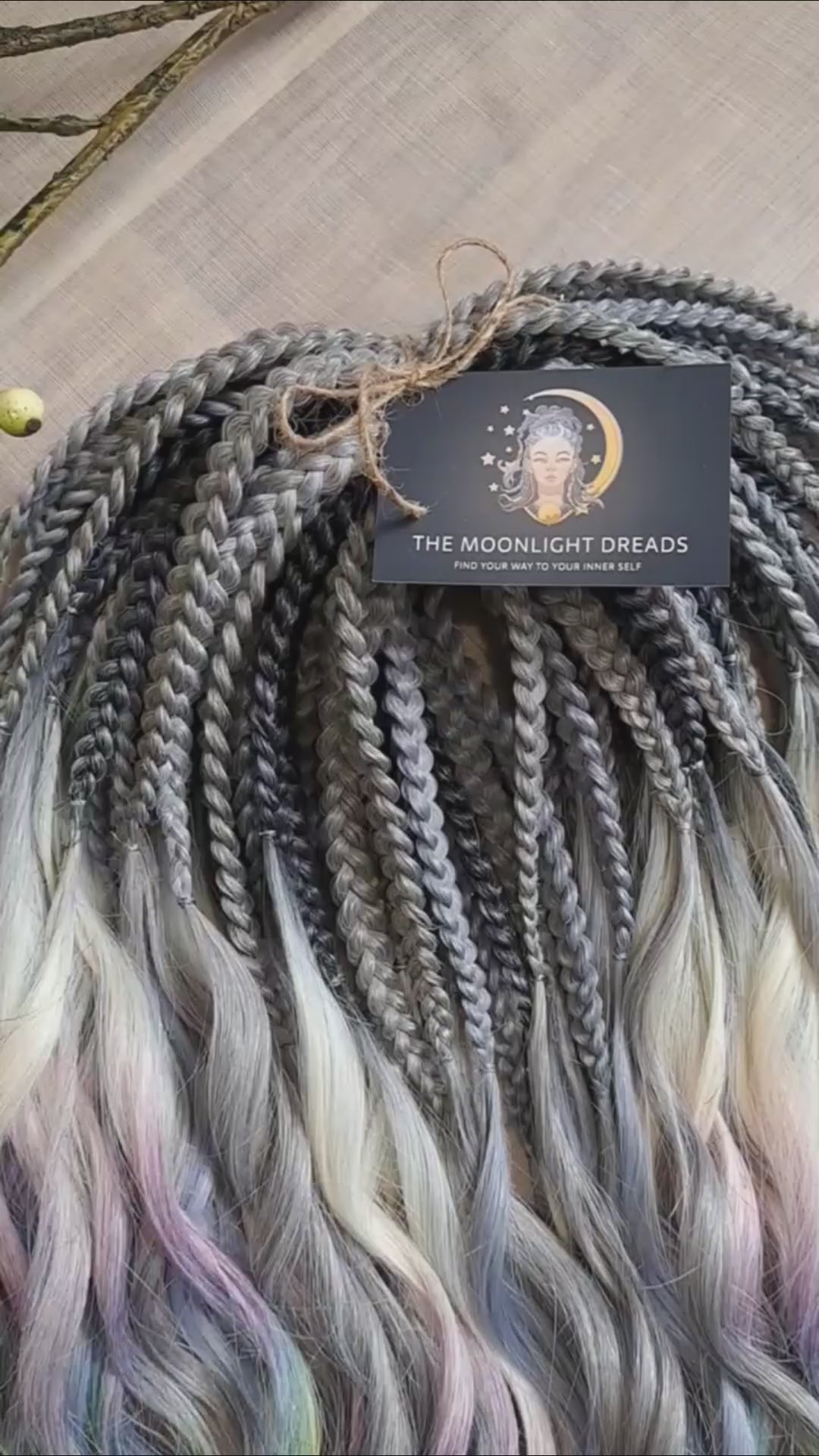Rainbow Ash - smoky silver, graphite, and rainbow/prism with icy blonde highlights. Soft, lightweight, and reusable synthetic brushable double ended wavy dreadlocks (regular dreaded, braided middle, or push-up).