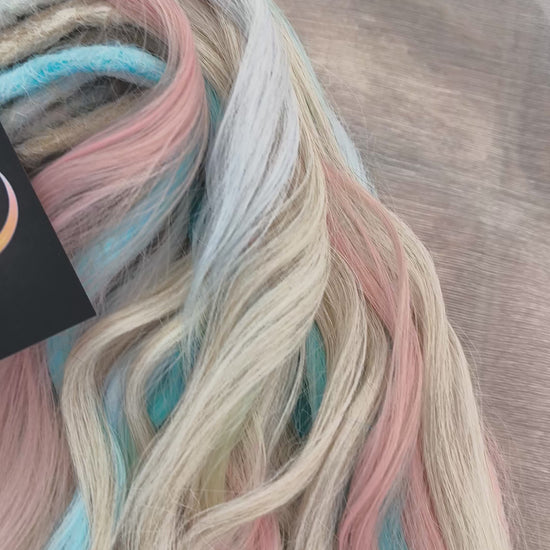 Second Life: Cotton Candy - 50 DE synthetic regular dreaded brushable curls (one-side dreaded part). A blend of platinum blonde, sky blue, pink, and rainbow colors.  Worn once . Has been washed and corrected. Good condition (a bit damaged ends).