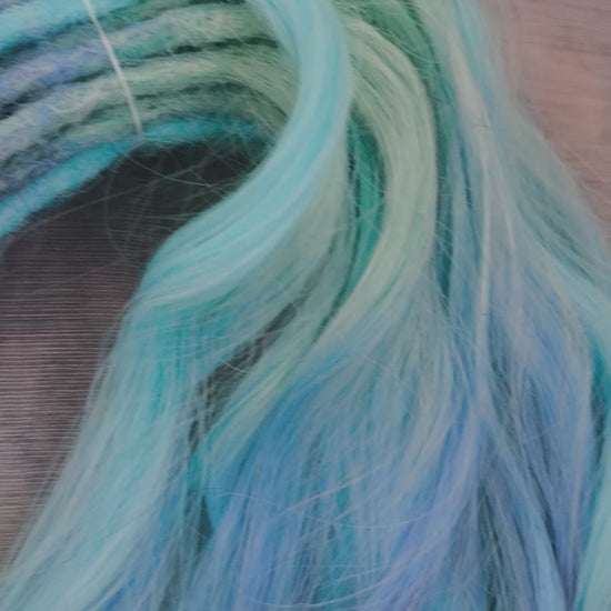 Blue Iris - soft, lightweight, and reusable; this set combines purple, cool blue, and deep navy brushable, synthetic double ended wavy dreadlocks.
