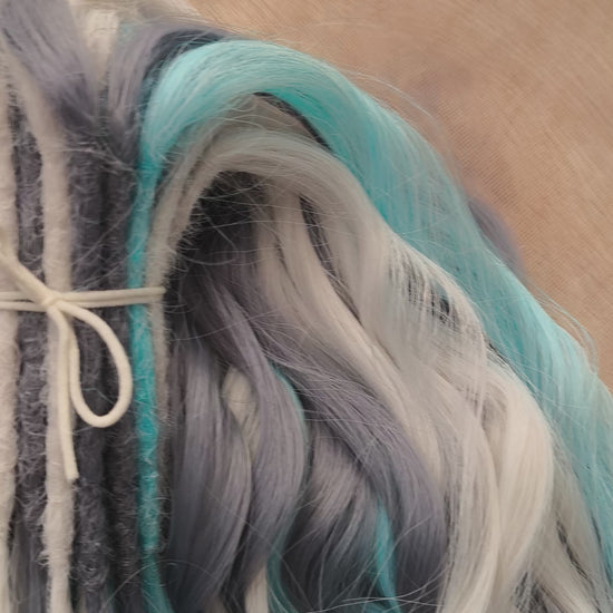 Let your hair channel the raw beauty of the Arctic with this striking icy blend. Arctic Ice features cool-toned waves in glacier blue, soft white, and smoky gray, flowing together like frozen mist over a winter sea.

Elegant, bold, and ethereal — this set is perfect for anyone who loves a crisp, dramatic look with an icy twist.