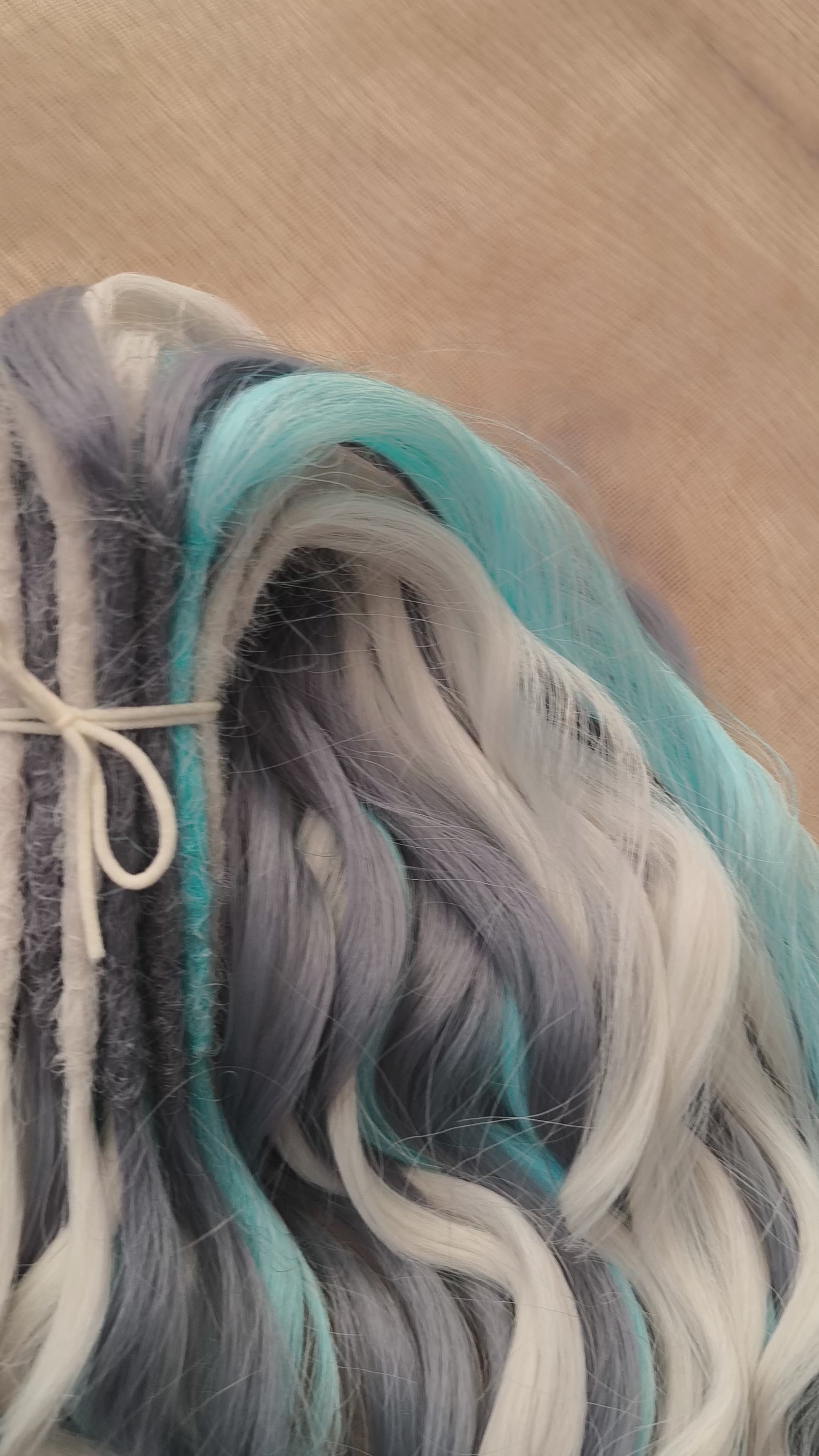 Let your hair channel the raw beauty of the Arctic with this striking icy blend. Arctic Ice features cool-toned waves in glacier blue, soft white, and smoky gray, flowing together like frozen mist over a winter sea.

Elegant, bold, and ethereal — this set is perfect for anyone who loves a crisp, dramatic look with an icy twist.