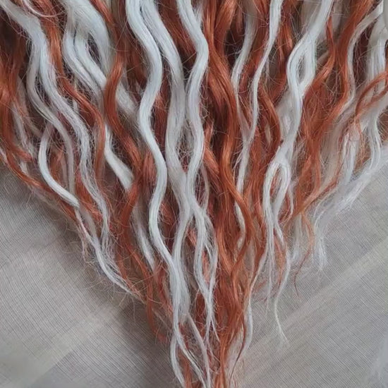 Crochet dreadlocks with wavy, wispy ends. Warm copper and terracotta tones combined with crisp white strands. Worn once during 4 weeks. Has been washed and corrected. Very good condition.

Quantity: 52 DE&nbsp;
Length: ±24 inches (60 cm)
Weight: ±16,6 oz (470 gr)