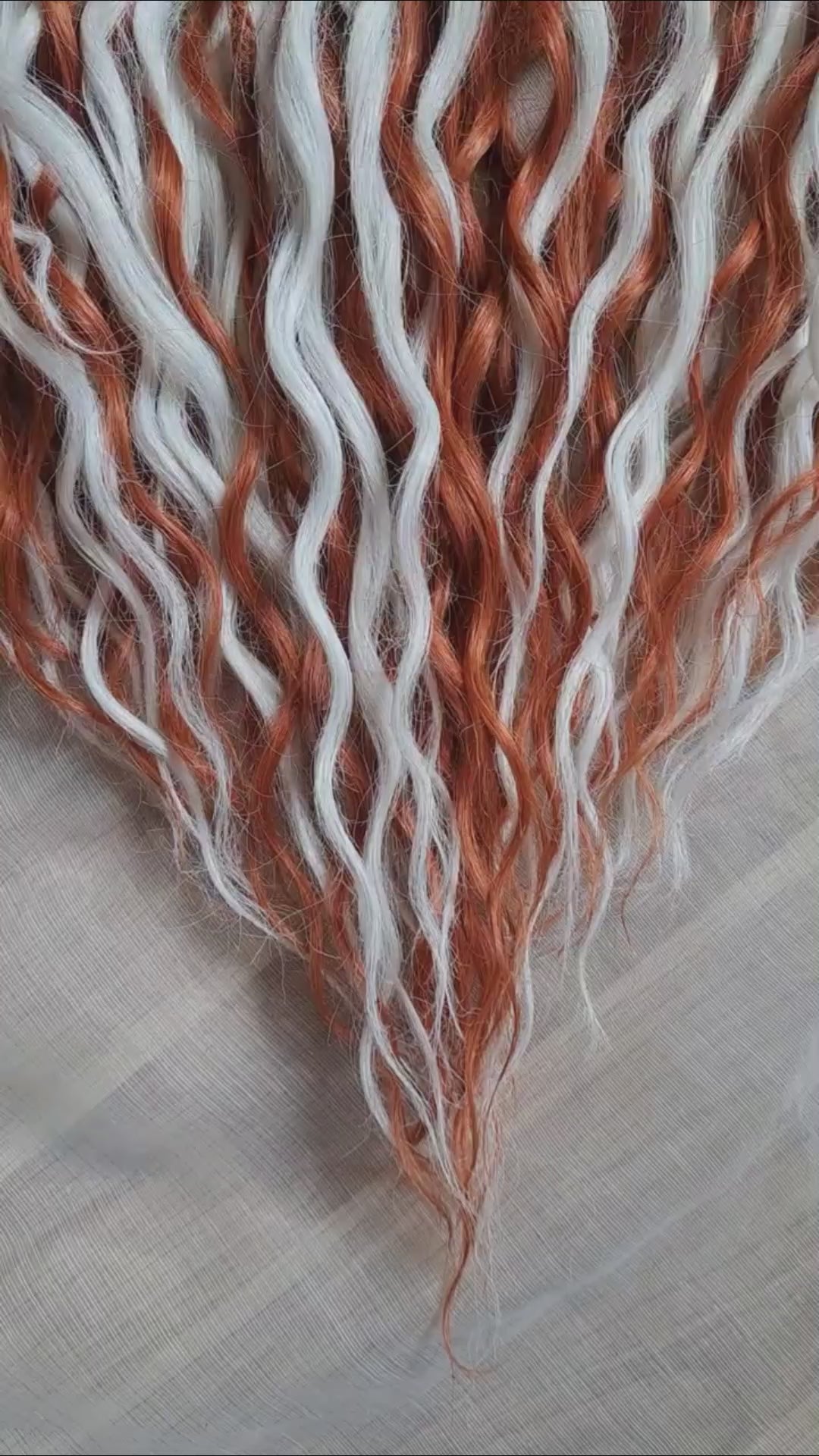 Crochet dreadlocks with wavy, wispy ends. Warm copper and terracotta tones combined with crisp white strands. Worn once during 4 weeks. Has been washed and corrected. Very good condition.

Quantity: 52 DE&nbsp;
Length: ±24 inches (60 cm)
Weight: ±16,6 oz (470 gr)