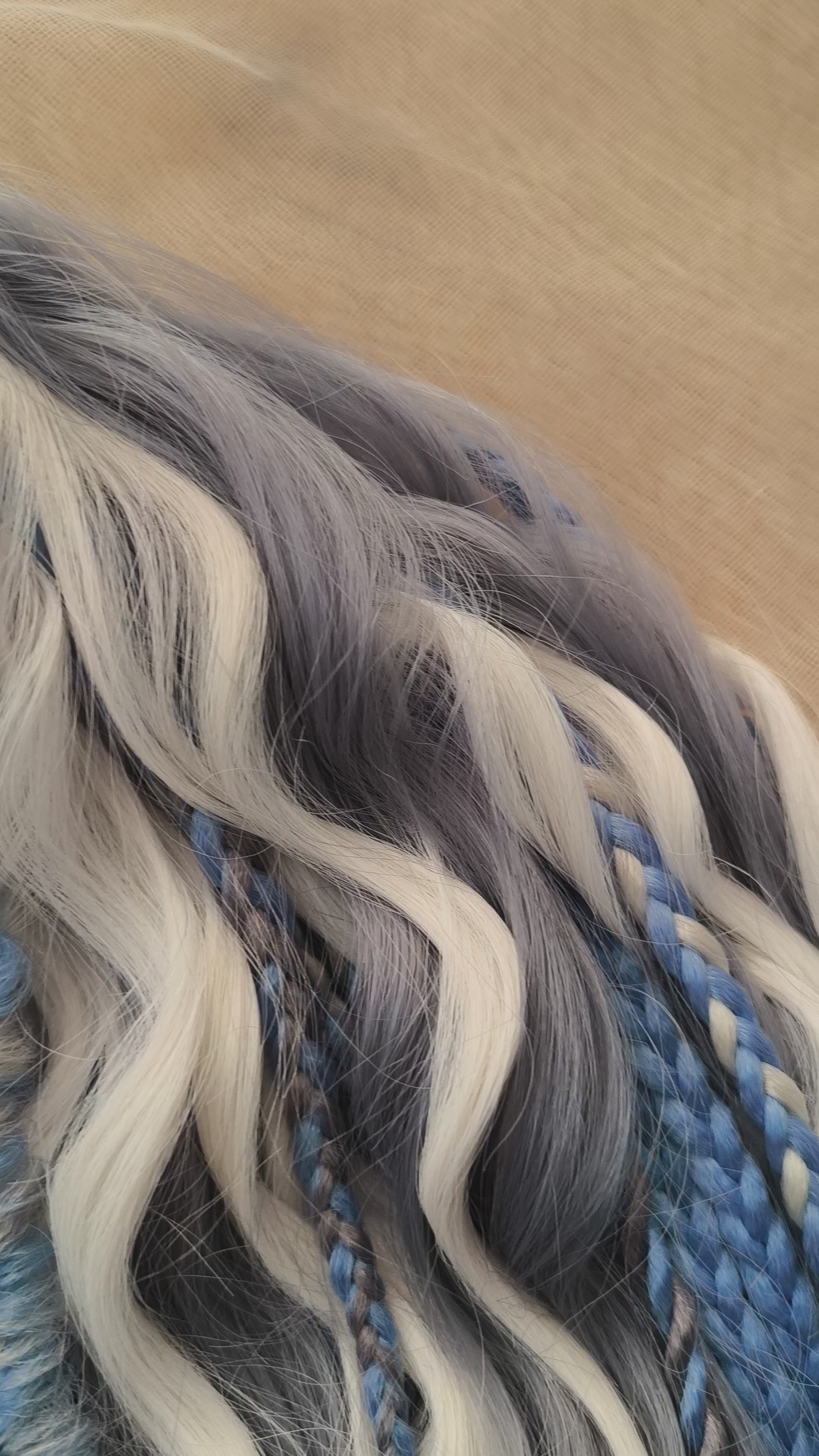Arctic Ice: soft, lightweight, and reusable 60 double ended various synthetic braids, Senegalese twists, and brushable regular dreaded curls. A mix of white, sky blue and steel blue colours.

The length is 22-24 inches (55-60 cm)
Dreaded part of curls: 3-4 inches (8-10 cm)
Thickness of braids ±0.8 cm