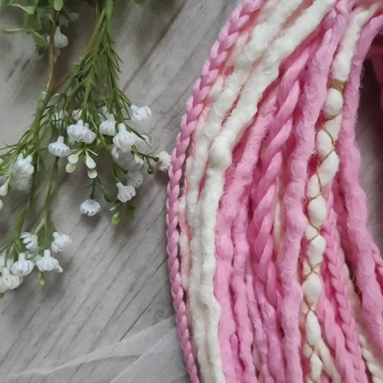 A soft blend of creamy white and gentle pink tones double ended crochet bumpy dreads, braids, and Senegalese twists. Decoration is included. Reusable lightweight set made from high-quality synthetic hypoallergenic material kanekalon.

Standard length: ±22-24 inches (55-60 cm)
Thickness of dreads and braids: ±0.8 cm