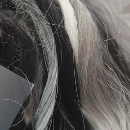 Silver Raven - 50 double ended ready-to-ship black, silver-grey, and white synthetic brushable wavy dreadlocks. Soft, lightweight, and reusable, a monochromatic blend with a dark, mysterious, witchy feel. Your spooky season look starts here
