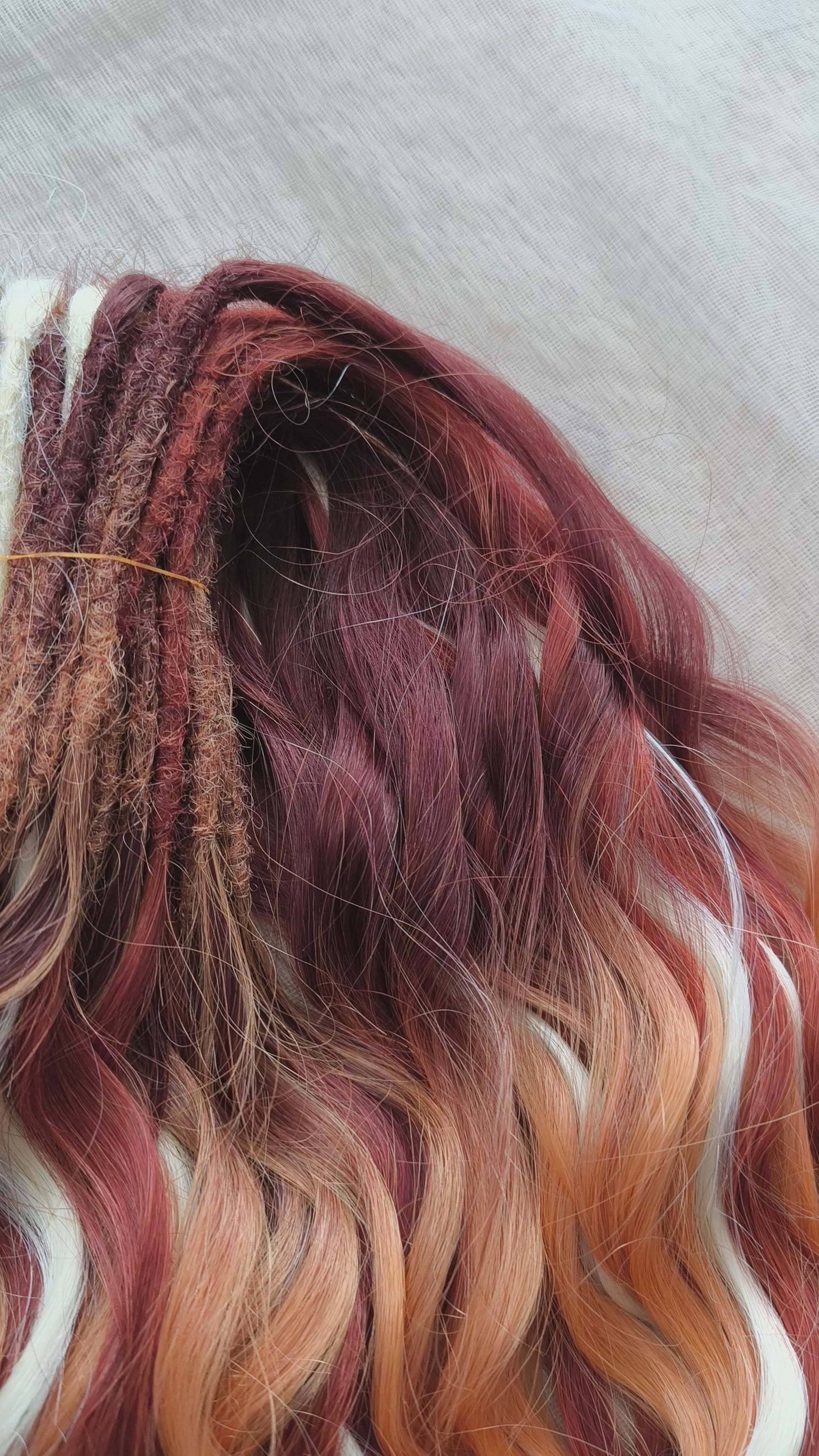This set combines a rich three-tone ombré gradient — deep chestnut, warm copper, and pale blonde — with additional solid strands in copper and creamy platinum, creating a stunning play of light and color.

Inspired by autumn leaves, glowing embers, and the graceful energy of a wild fox, Amber Fox is made to stand out with both softness and strength.

Soft, lightweight, and reusable synthetic brushable double ended wavy dreadlocks (available as regular dreaded, braided middle, or push-up).