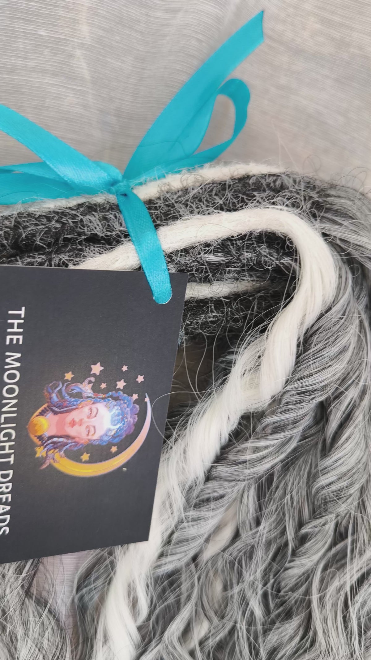 mix of ombre from grey to white and snow white, lightweight, and reusable double ended synthetic standard dreaded non-brushable curls