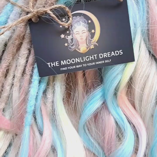 Ready to Ship: Cotton Candy - soft, lightweight, and reusable 50 double ended synthetic brushable dreaded curls. A blend of platinum blonde, sky blue, pink, and rainbow colors creates a light, airy look full of soft color transitions.

Length: 22-24 inches (55-60 cm)
Dreaded part (one-side dreaded): ±4-5 inches (±10-12 cm)
Weight: ±300 gr (10,6 oz)