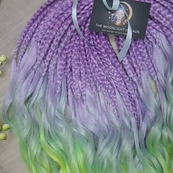 ombre from purple/lavender to light green and yellow brushable curls with braided middle 