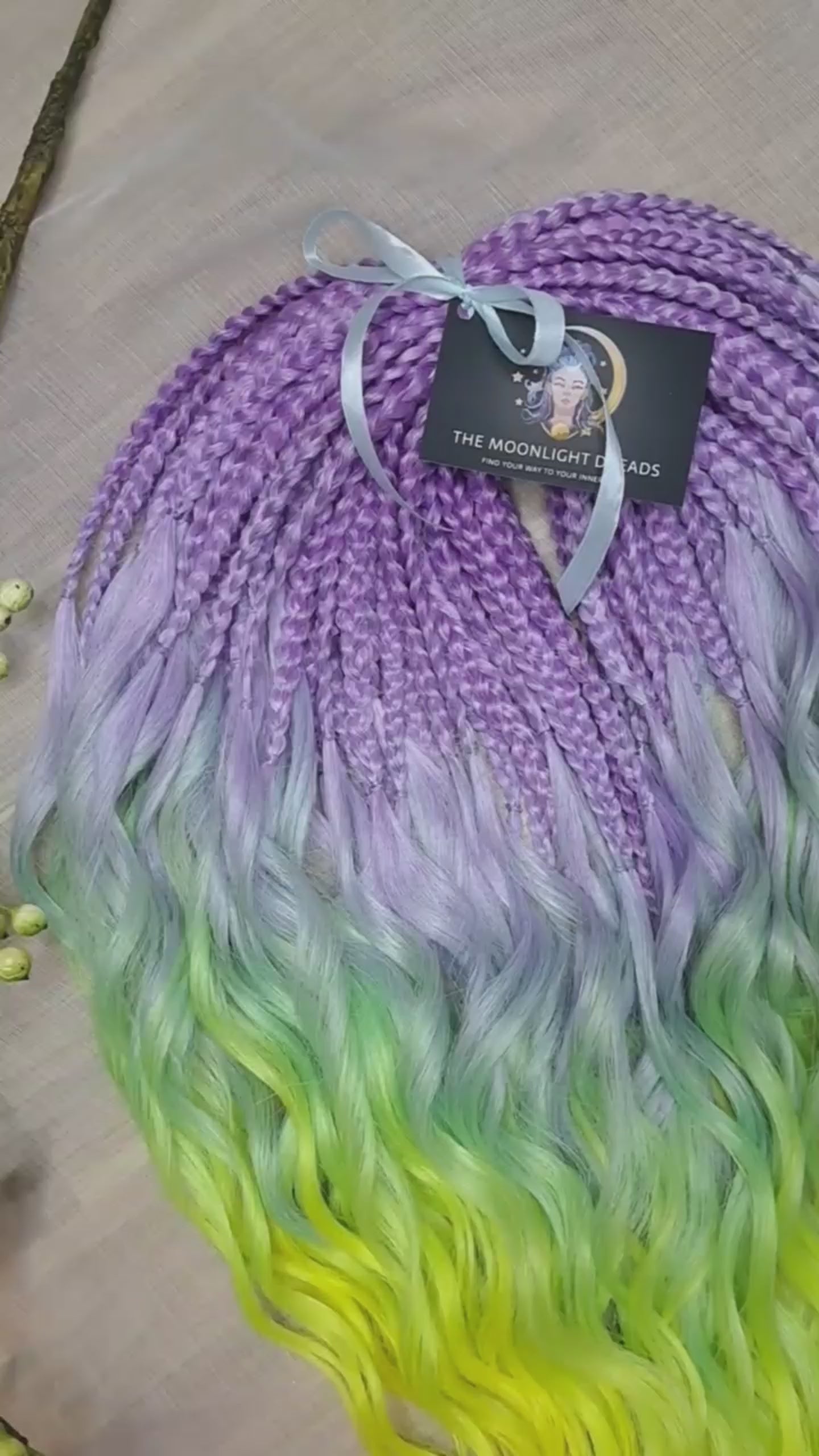 ombre from purple/lavender to light green and yellow brushable curls with braided middle 