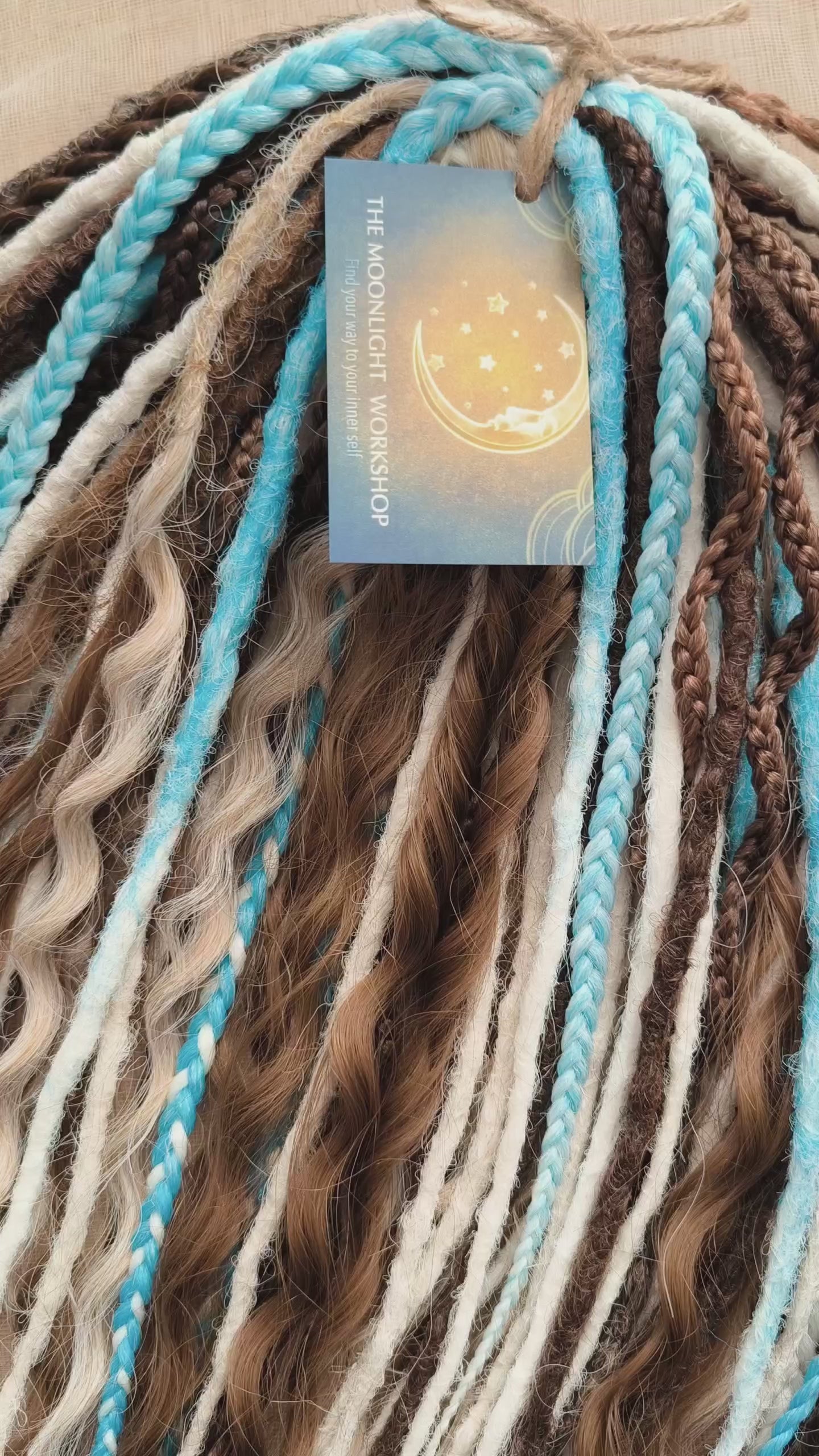 A calm mix of cocoa brown, creamy blonde, and bright blue accents - lightweight, &nbsp;reusable synthetic double ended crochet dreadlocks, curls, braids, and Senegalese twists.

Standard length: ±22-24 inches (55-60 cm)
Thickness of dreads and braids: ±0.8 cm
Dreaded part of curls ±8-10 cm (3-4 inches)