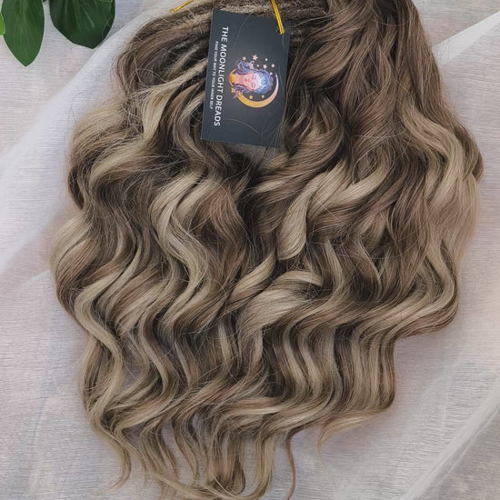 Ash Browny - 60 DE soft, lightweight, and reusable synthetic standard dreaded brushable curls Manasi. A mix of ash wheat blonde with dark chocolate brown roots and brown