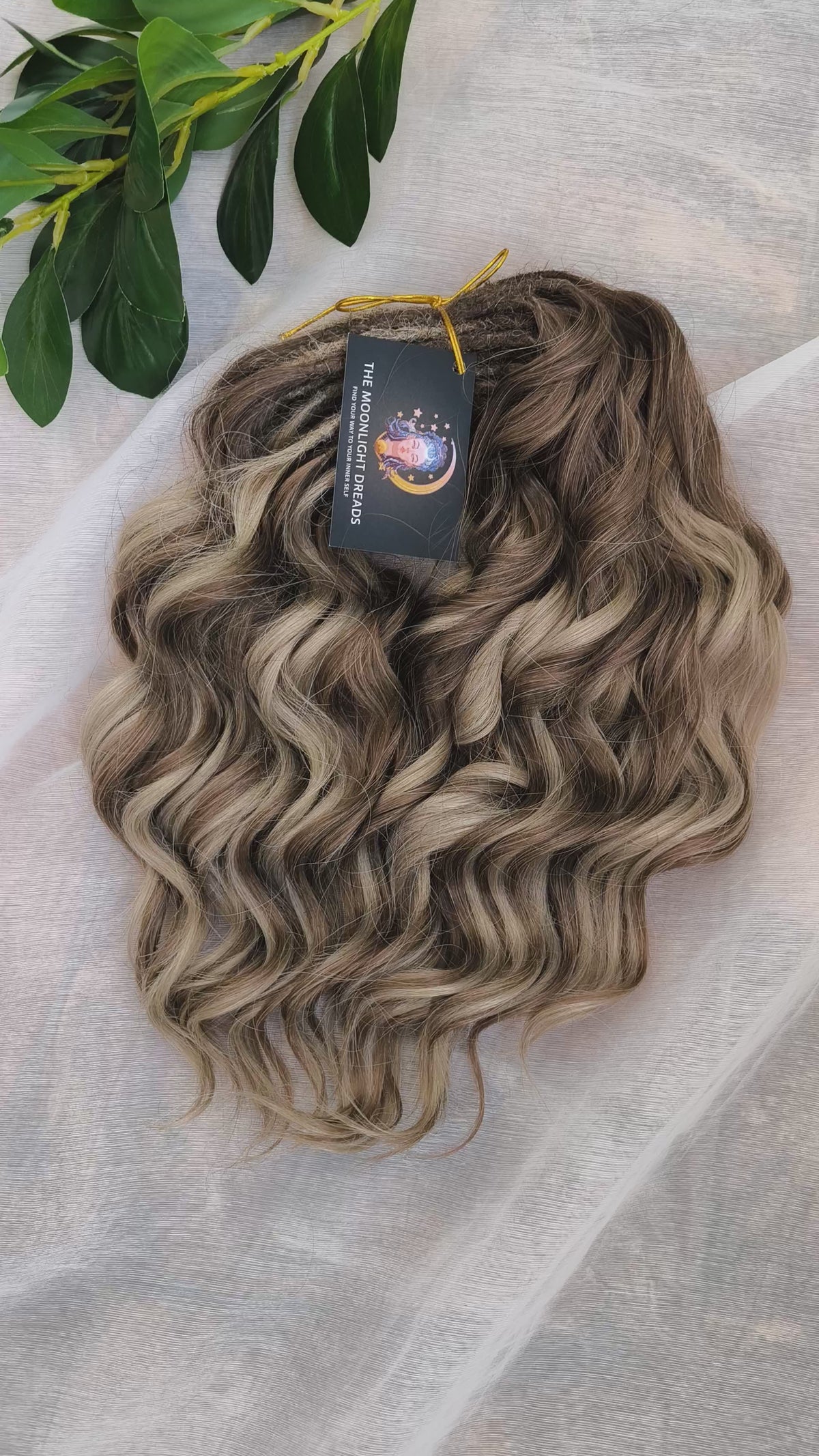 Ash Browny - 60 DE soft, lightweight, and reusable synthetic standard dreaded brushable curls Manasi. A mix of ash wheat blonde with dark chocolate brown roots and brown