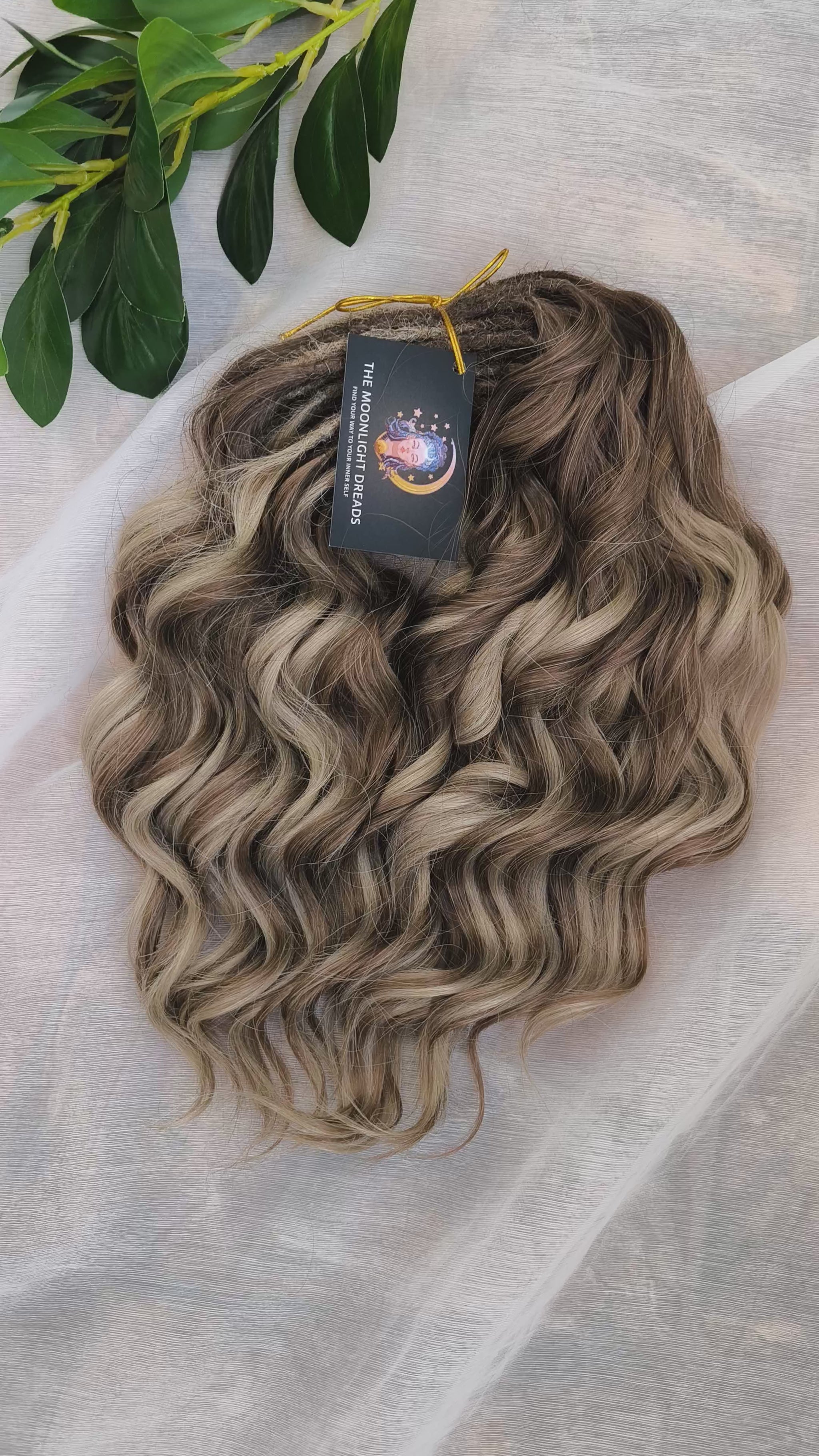 Ash Browny - 60 DE soft, lightweight, and reusable synthetic standard dreaded brushable curls Manasi. A mix of ash wheat blonde with dark chocolate brown roots and brown
