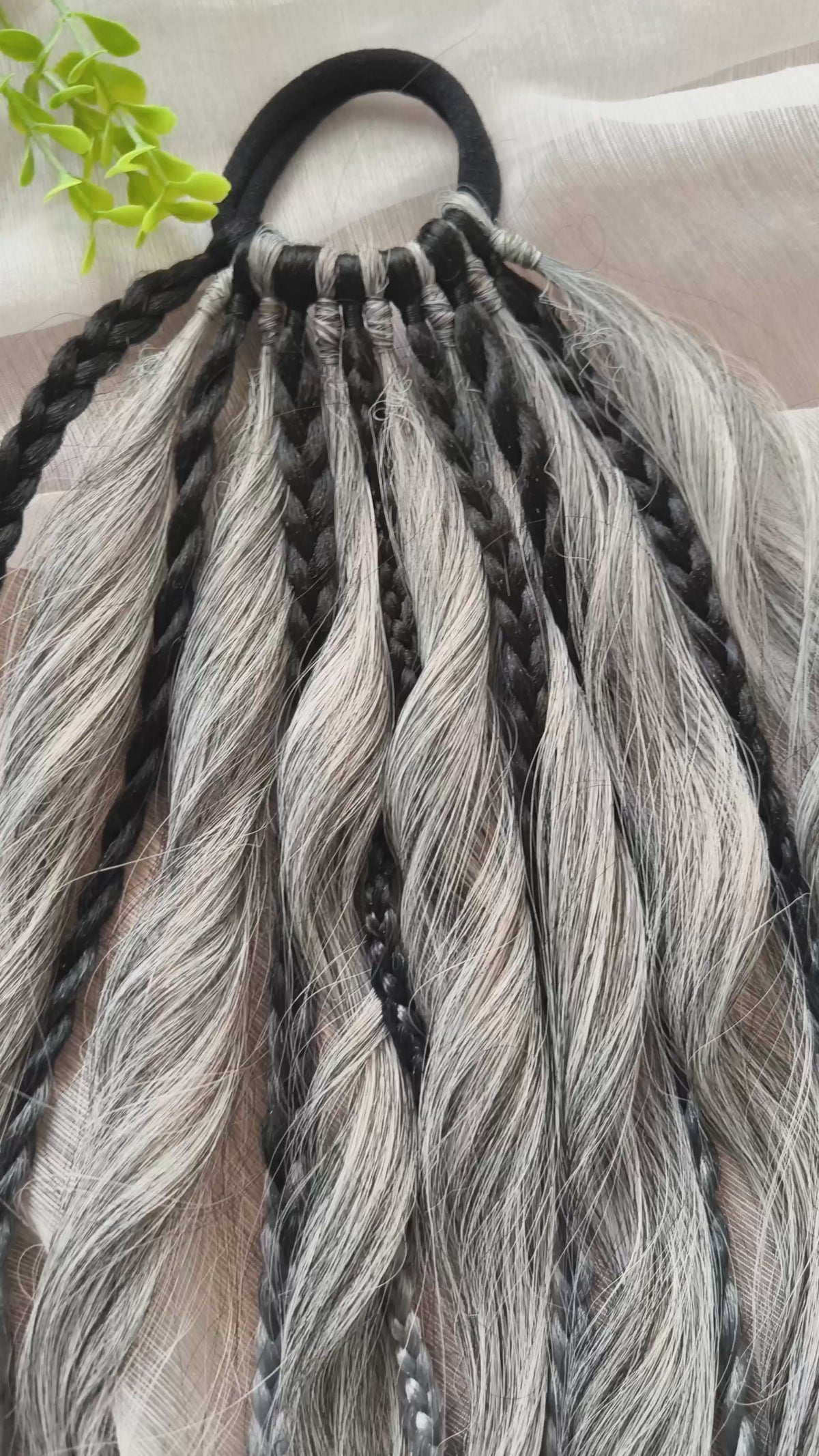 Grey, black, and white braids and curls on an elastic band — a simple way to transform a ponytail without installing a set