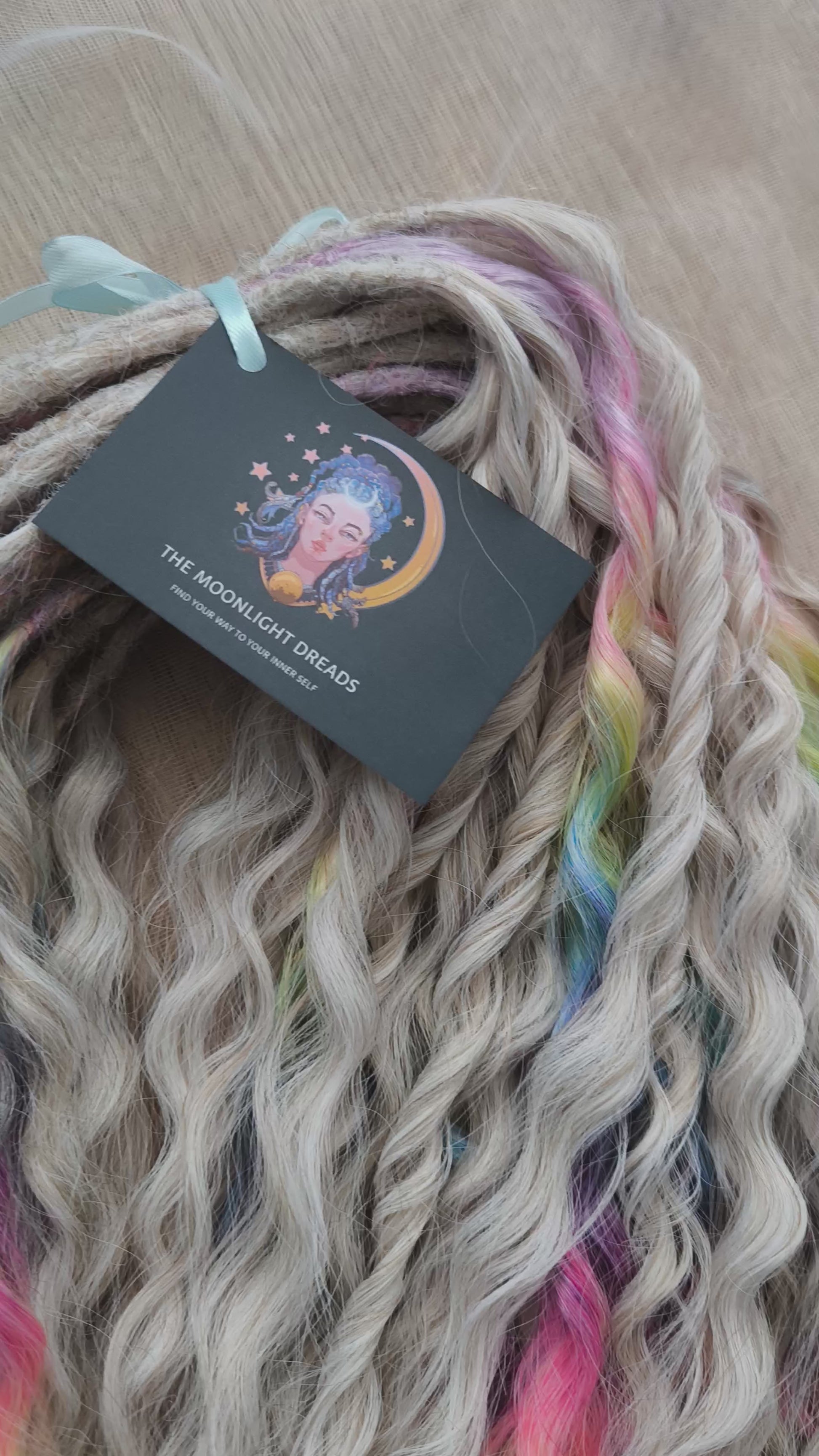 White Rainbow: the mix of Platinum Blonde (2/3 parts of blonde) + and Rainbow/glitch/prism effect (1/3 part of rainbow) soft, lightweight, and reusable synthetic brushable double ended wavy dreadlocks (NOT BRUSHABLE).