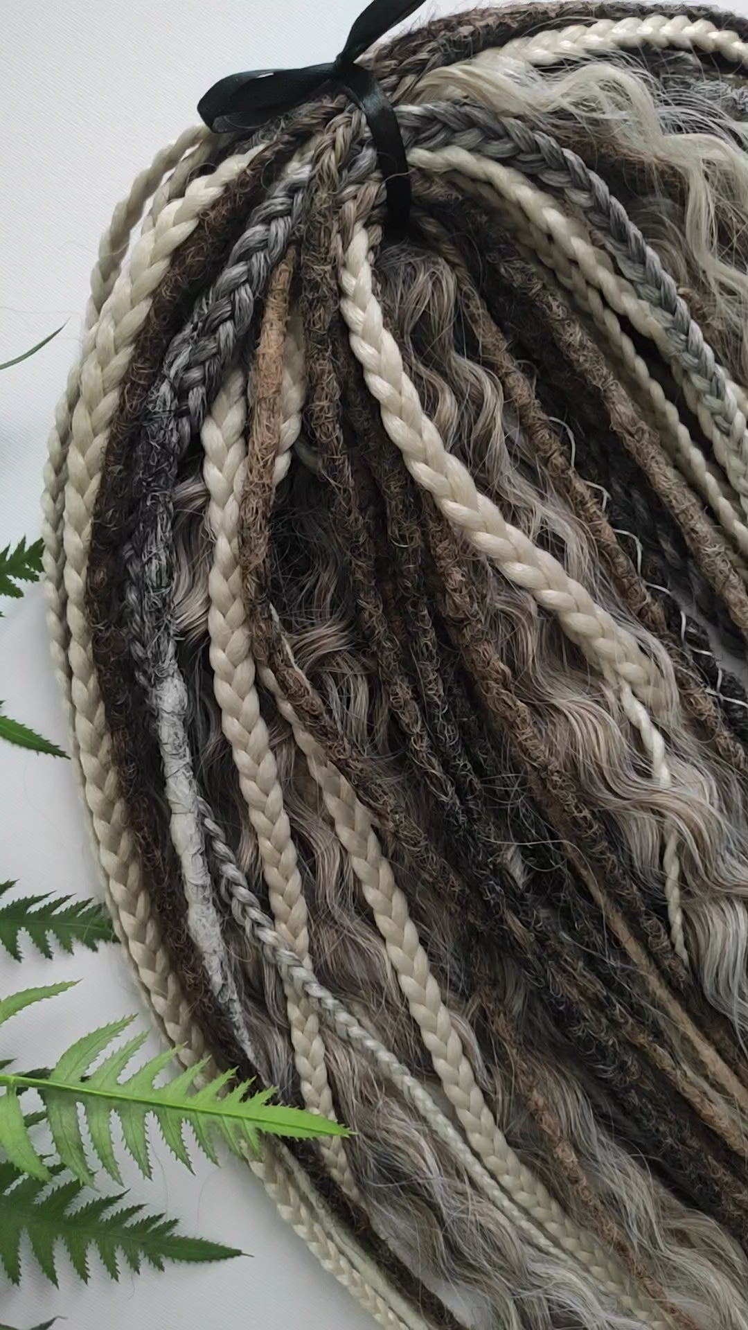 A mix of browns and ash blonde - lightweight,  reusable synthetic double ended crochet dreadlocks, non-brushable curls, braids, and Senegalese twists.
