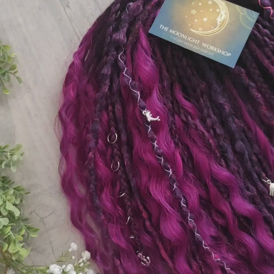 A rich, saturated magenta shade with deep berry and purple undertones. The color shifts between dark fuchsia, plum, and wine tones, creating depth and dimension throughout the set.  Soft, lightweight, and reusable double ended braids, Senegalese twists, and non-brushable dreaded curls.

Standard length: ±22-24 inches (55-60 cm)
Thickness of dreads and braids: ±0.8 cm
Dreaded part of curls ±8-10 cm (3-4 inches)