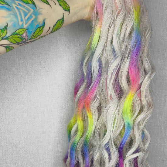 The mix of Platinum blonde and Rainbow/glitch/prism effect (2/3 parts of blonde + 1/3 part of rainbow) soft, lightweight, and reusable synthetic brushable double ended wavy dreadlocks (regular dreaded or push-up).