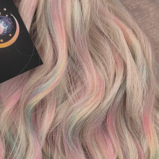 Fairy Dust - 50 DE soft, lightweight, and reusable synthetic standard dreaded brushable curls. A mix of platinum blonde and pastel rainbow/prism