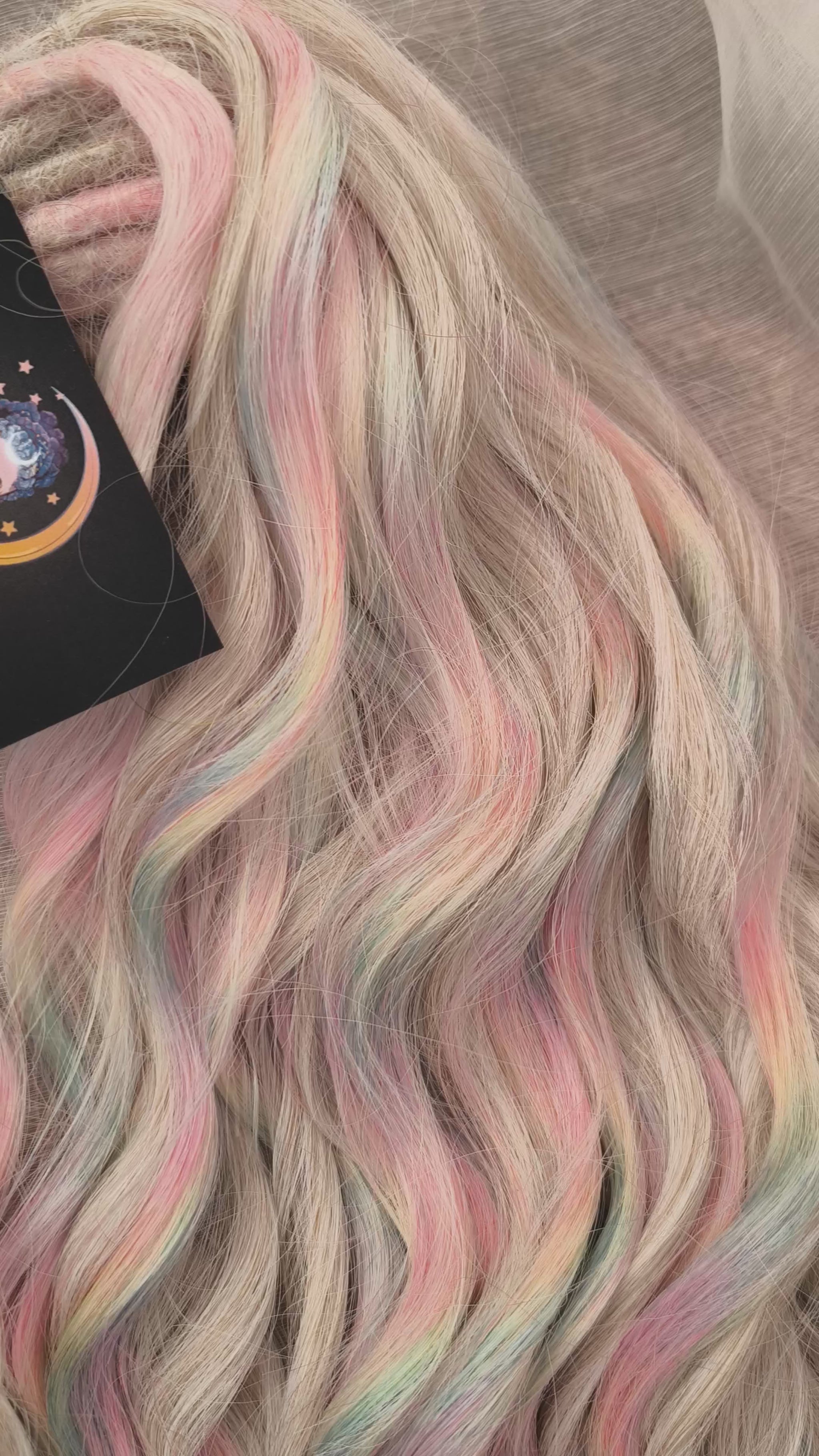 Fairy Dust - 50 DE soft, lightweight, and reusable synthetic standard dreaded brushable curls. A mix of platinum blonde and pastel rainbow/prism