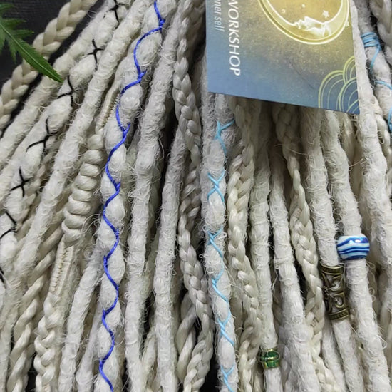 This set of synthetic dreadlocks combines elements of a Viking-inspired aesthetic.
Scandinavian blonde double ended crochet bumpy dreads, braids, and Senegalese twists. Decoration is included. Reusable lightweight set made from high-quality synthetic hypoallergenic material kanekalon.

Standard length: ±22-24 inches (55-60 cm)
Thickness of dreads and braids: ±0.8 cm